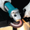 Angle Grinders | Makita 9557PB 4-1/2 in. Paddle Switch AC/DC Angle Grinder image number 1