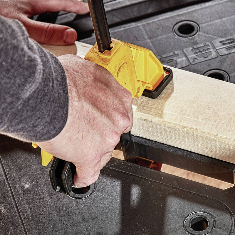 Holes throughout work surface make this compatible with DEWALT clamps